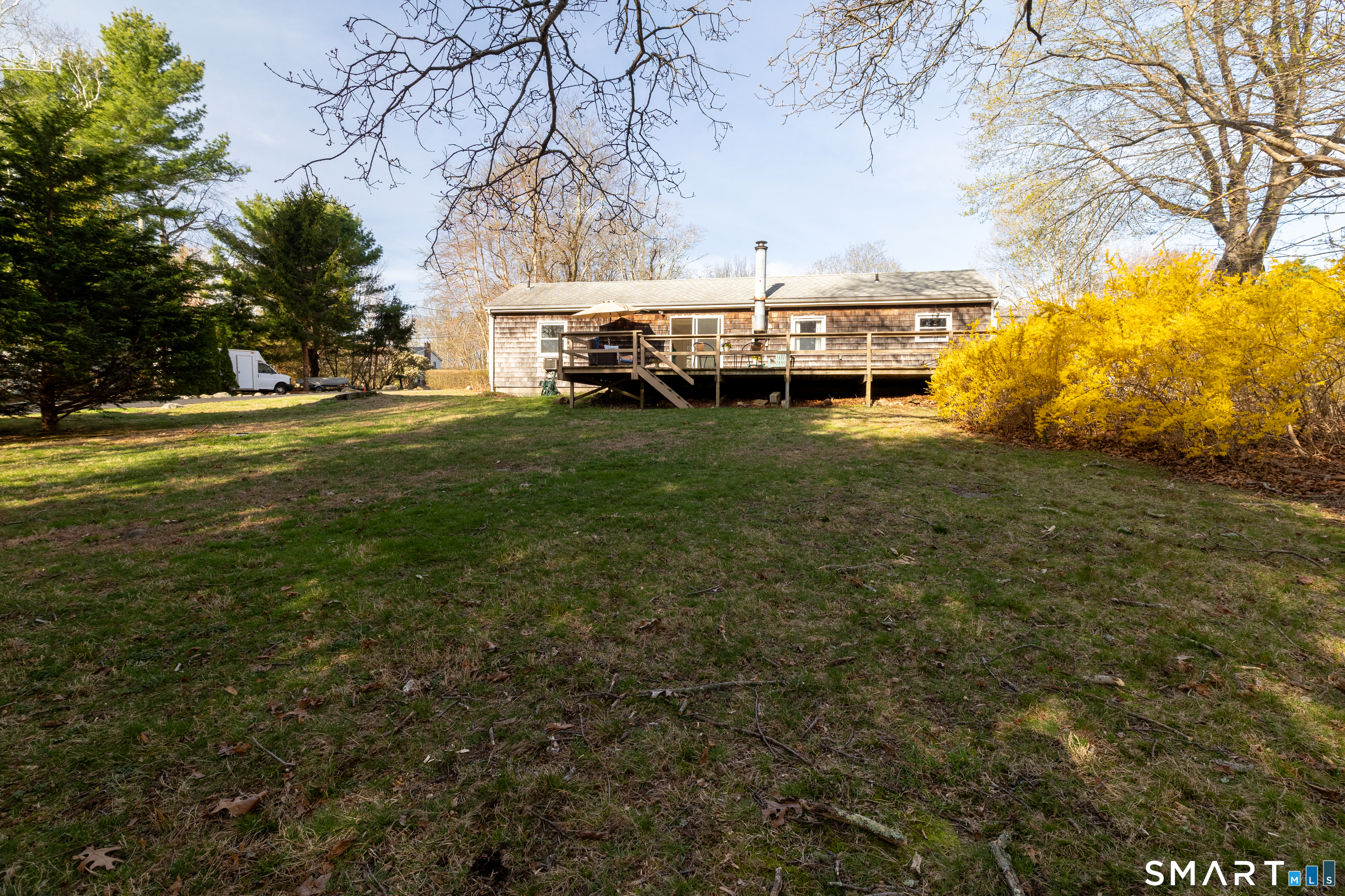 226 Pequot Avenue Groton, CT 06355 - Photo 3 of 11 a table and chairs sitting in the middle of a yard