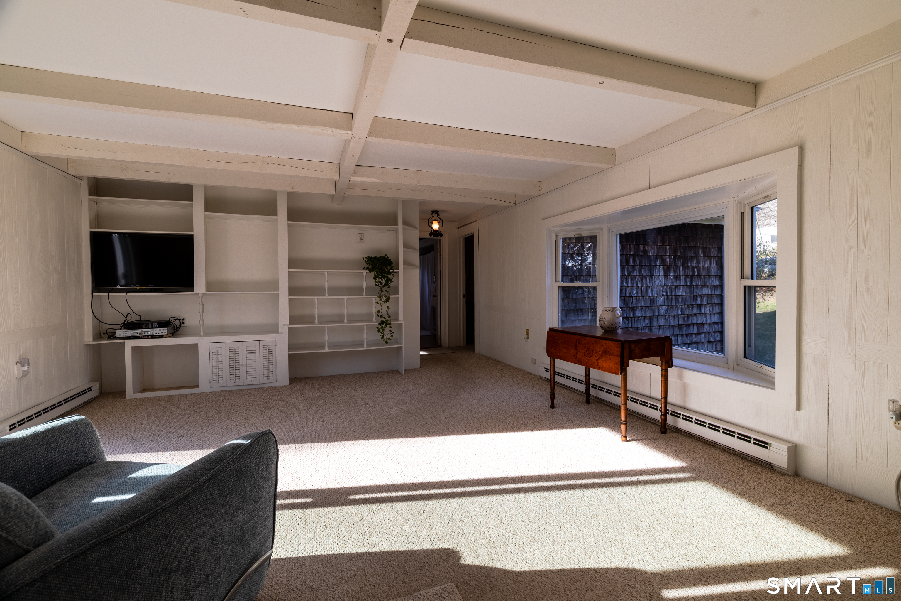 226 Pequot Avenue Groton, CT 06355 - Photo 6 of 11 a living room with furniture and a flat screen tv