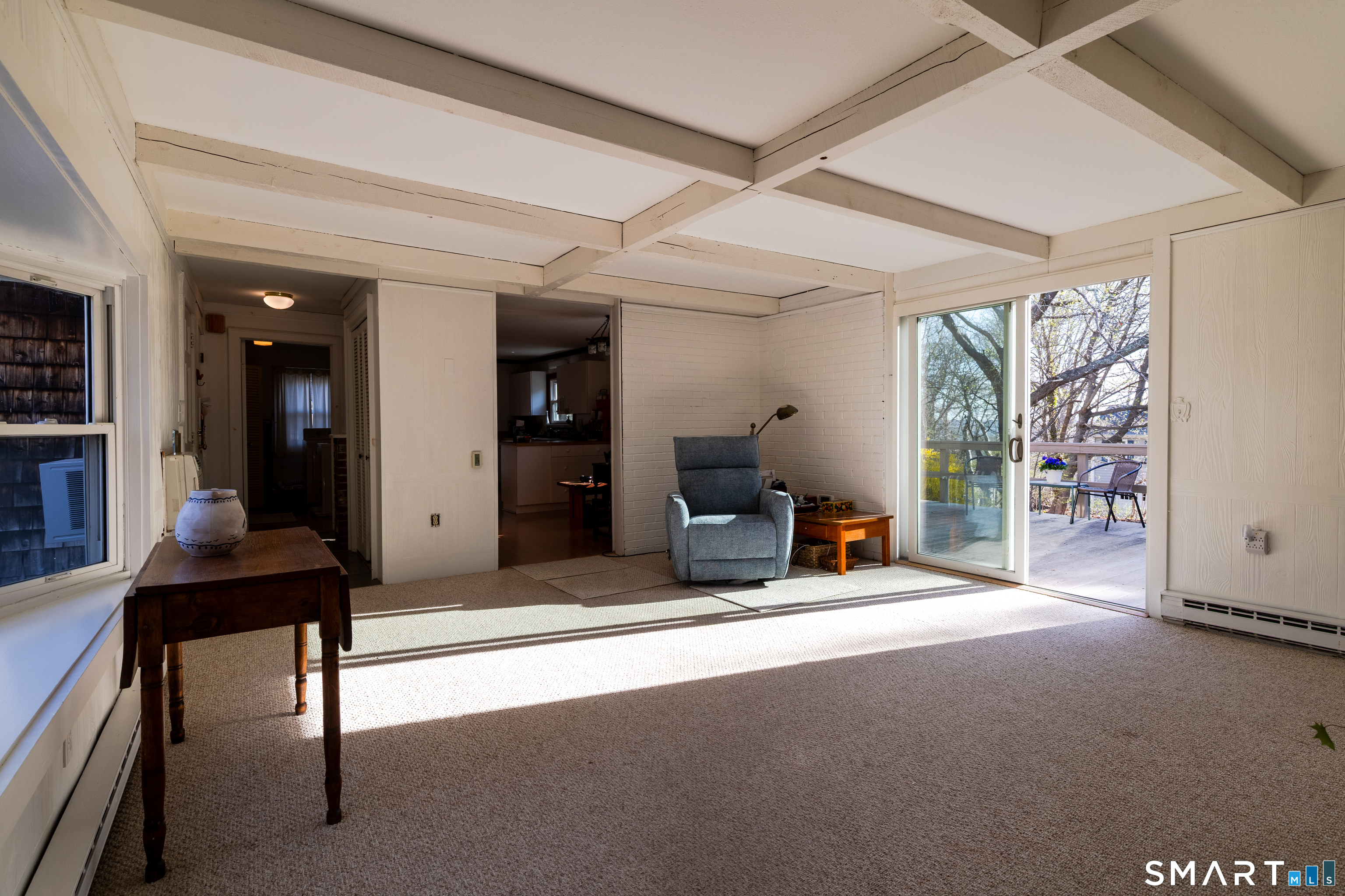 226 Pequot Avenue Groton, CT 06355 - Photo 7 of 11 a living room with furniture a flat screen tv and a large window