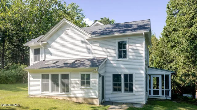 a view of house with yard