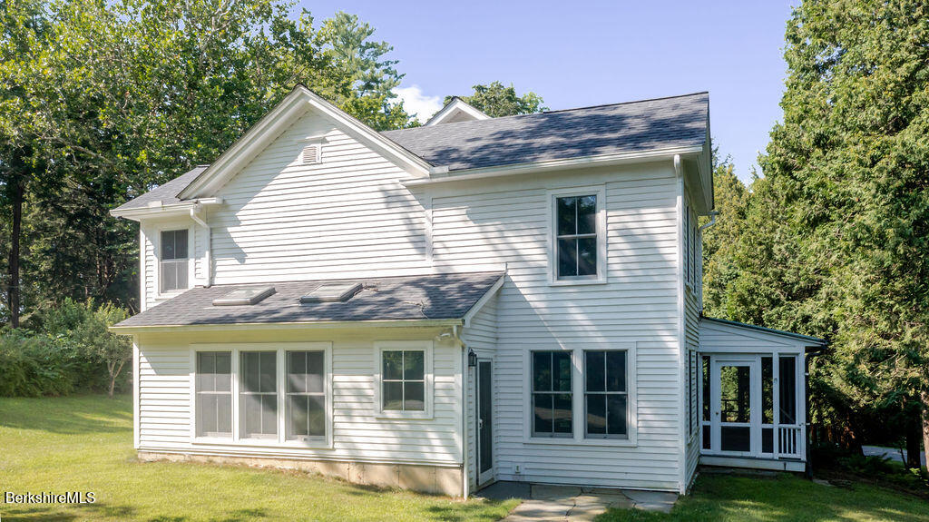 a view of house with yard