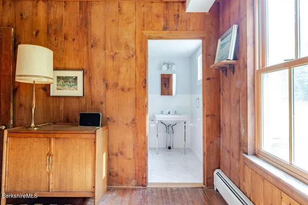 a view of a bathroom with a sink and a mirror