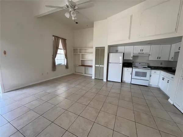 a kitchen with stainless steel appliances a sink a stove a microwave and cabinets