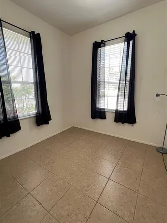 an empty room with windows
