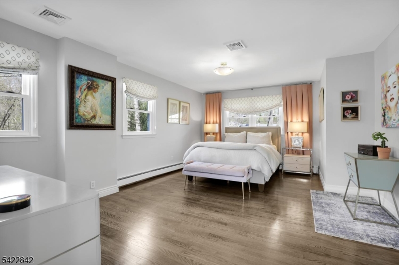 36 Coppergate Drive Bernards, NJ 07920 - Photo 13 of 50 a bedroom with a bed and wooden floor