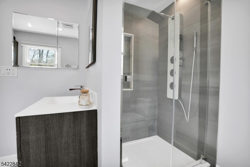 36 Coppergate Drive Bernards, NJ 07920 - Photo 16 of 50 a bathroom with a sink and a mirror