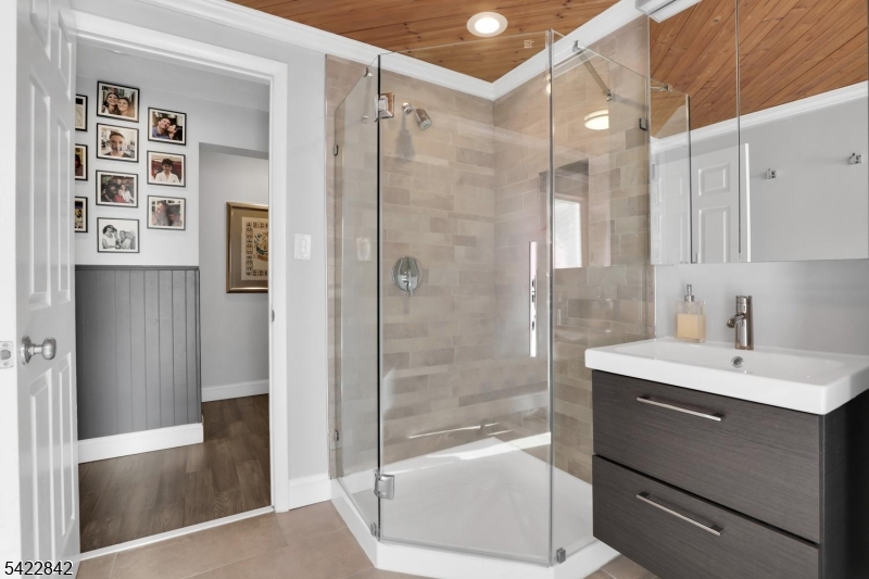 36 Coppergate Drive Bernards, NJ 07920 - Photo 36 of 50 a bathroom with a bathtub shower sink and mirror