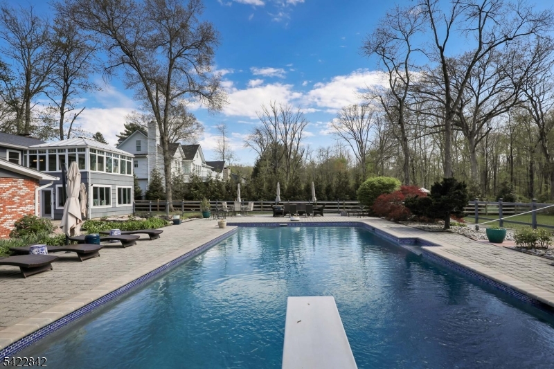 36 Coppergate Drive Bernards, NJ 07920 - Photo 38 of 50 a view of a swimming pool with lounge chair