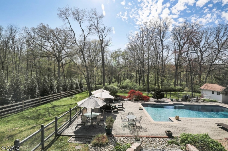 36 Coppergate Drive Bernards, NJ 07920 - Photo 42 of 50 a view of a lake with couches and a patio