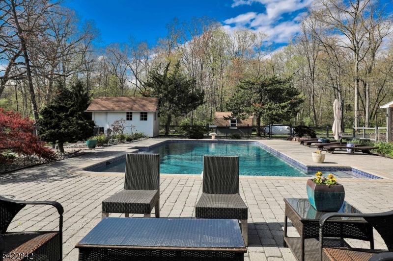 36 Coppergate Drive Bernards, NJ 07920 - Photo 44 of 50 a view of a swimming pool with lounge chairs