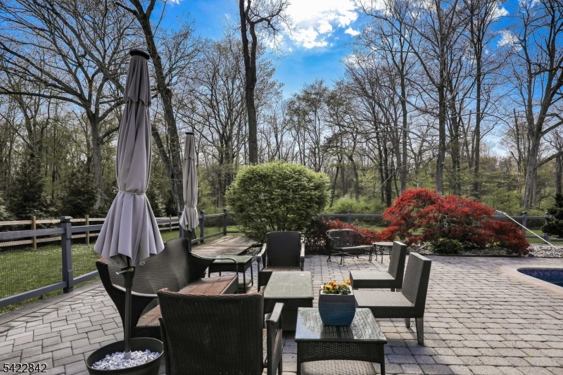 36 Coppergate Drive Bernards, NJ 07920 - Photo 46 of 50 a view of a chairs and table in backyard