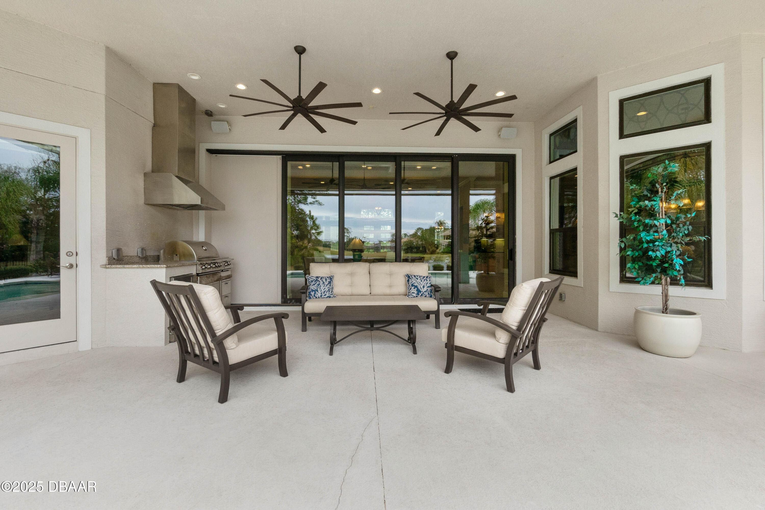 990 Downshire Lane Ormond Beach, FL 32174 - Photo 43 of 64 a living room with furniture and a large window