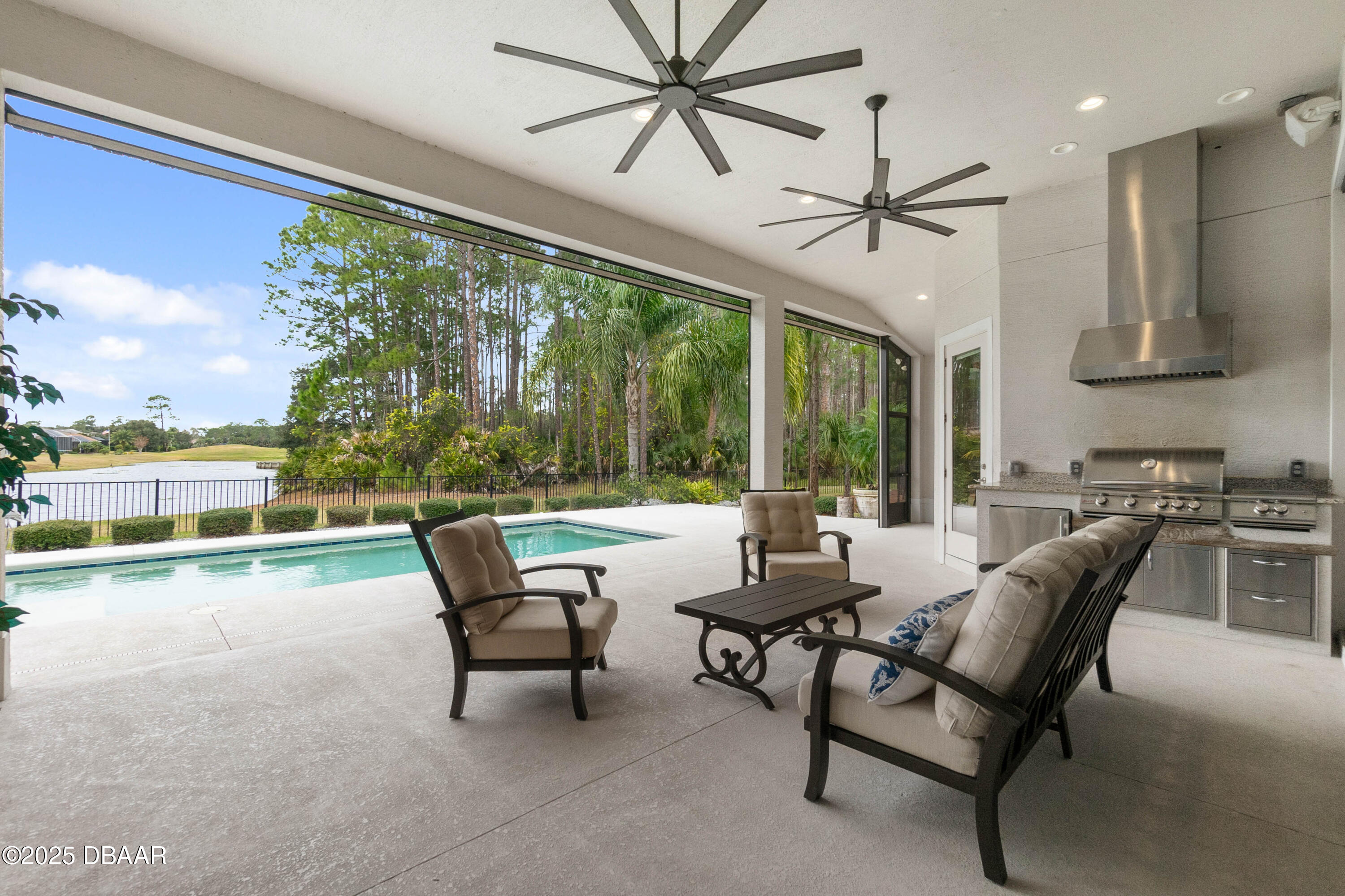990 Downshire Lane Ormond Beach, FL 32174 - Photo 45 of 64 a living room with furniture and a large window