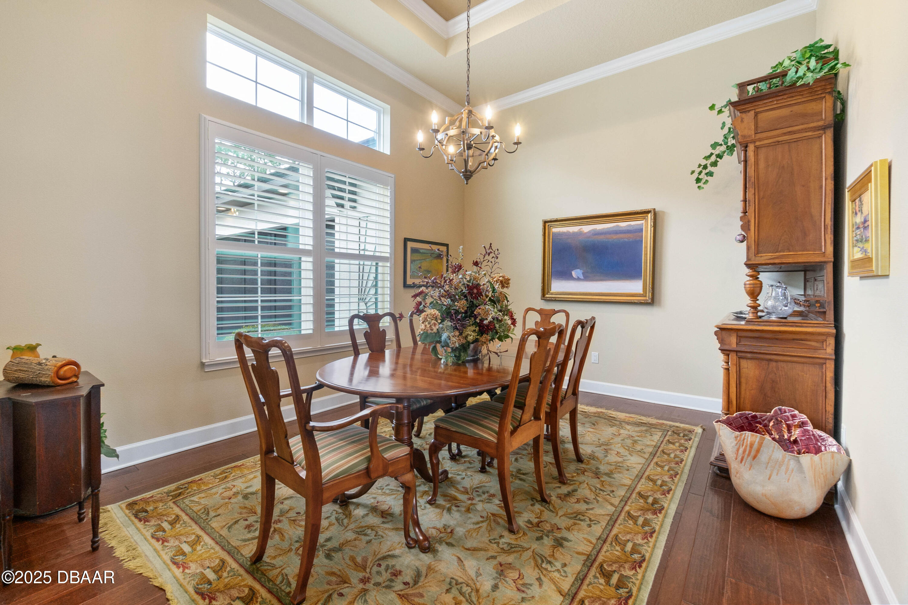 990 Downshire Lane Ormond Beach, FL 32174 - Photo 6 of 64 a view of a dining room with furniture and a chandelier