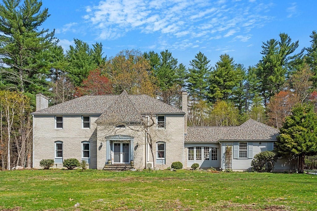 13 Olde Farms Road Boxford, MA 01921 - Photo 1 of 42 a front view of a house with a garden