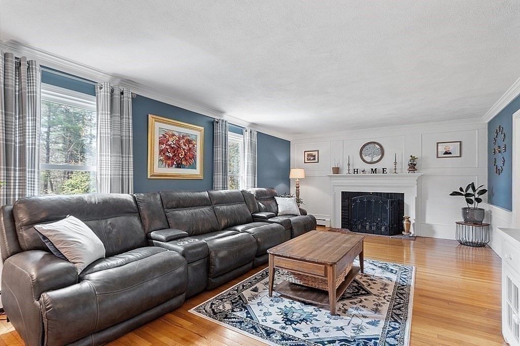 13 Olde Farms Road Boxford, MA 01921 - Photo 13 of 42 a living room with furniture and a fireplace