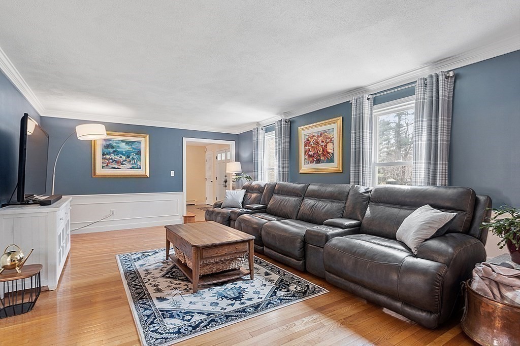 13 Olde Farms Road Boxford, MA 01921 - Photo 14 of 42 a living room with furniture and a flat screen tv