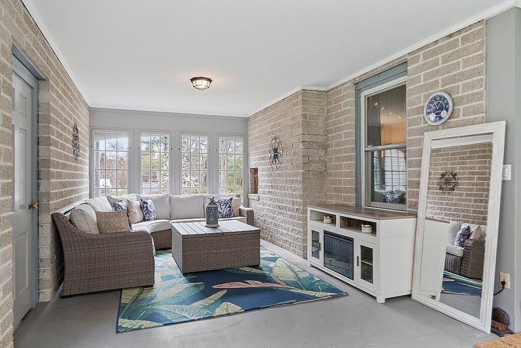 13 Olde Farms Road Boxford, MA 01921 - Photo 24 of 42 a living room with furniture a large window and a fireplace