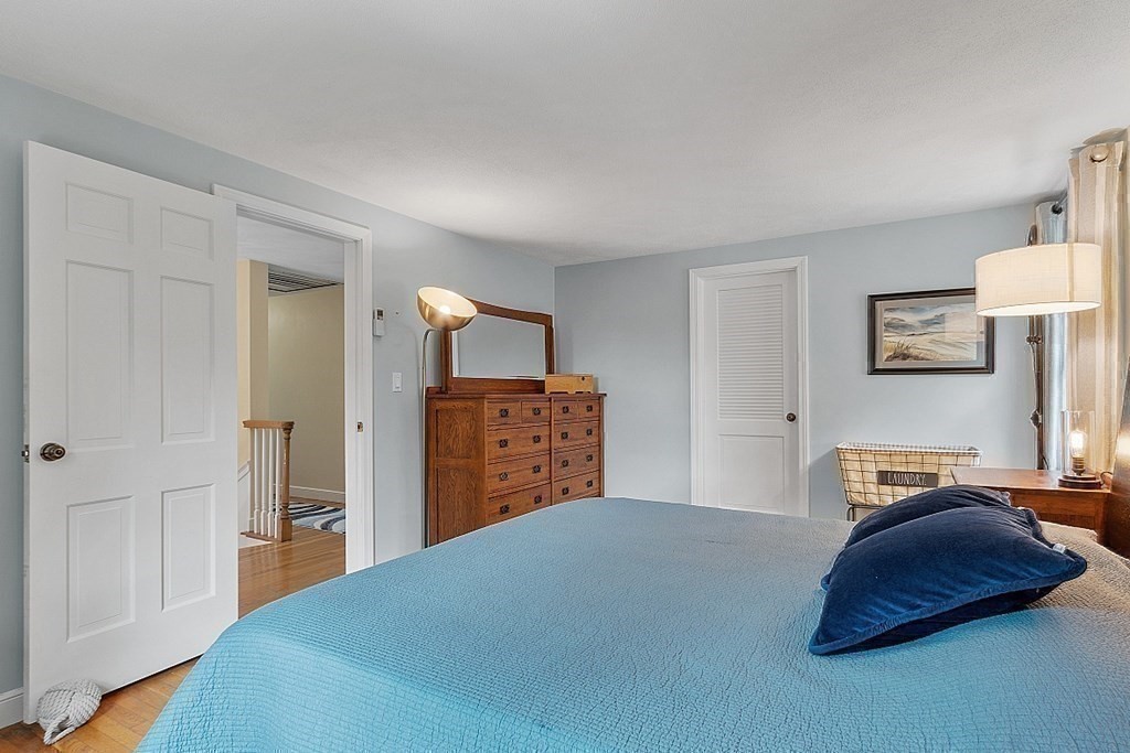 13 Olde Farms Road Boxford, MA 01921 - Photo 30 of 42 a bedroom with a bed and a cabinets
