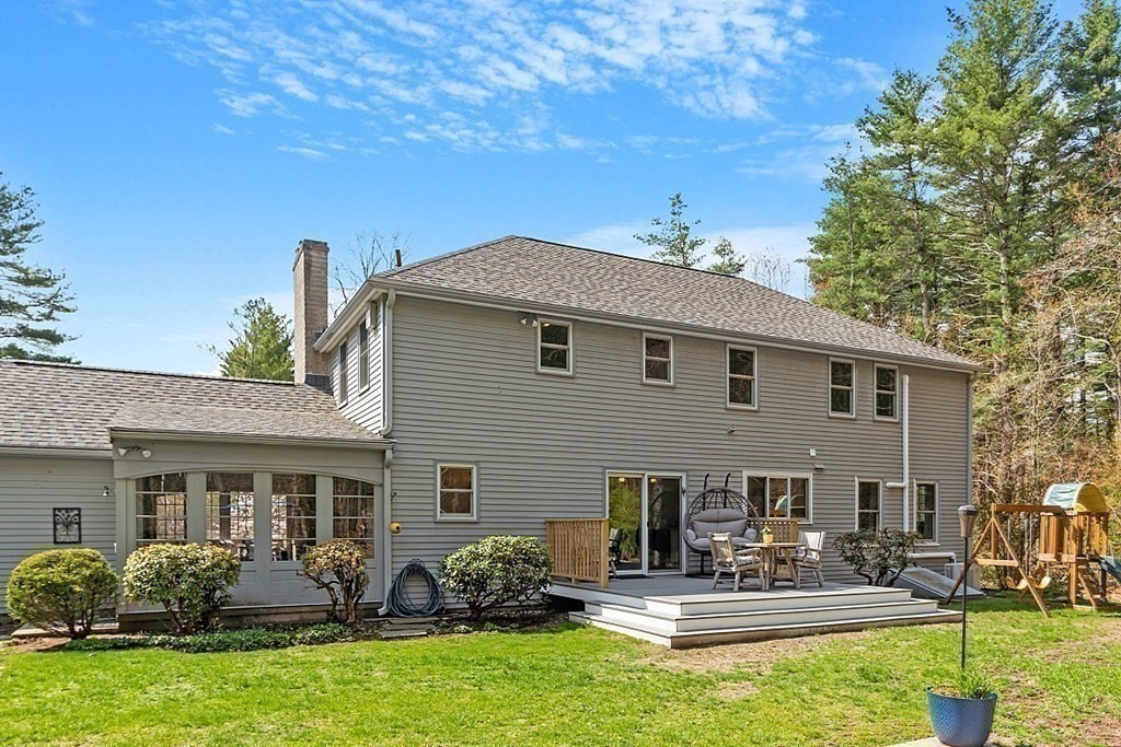 13 Olde Farms Road Boxford, MA 01921 - Photo 3 of 42 a front view of house with yard and outdoor seating