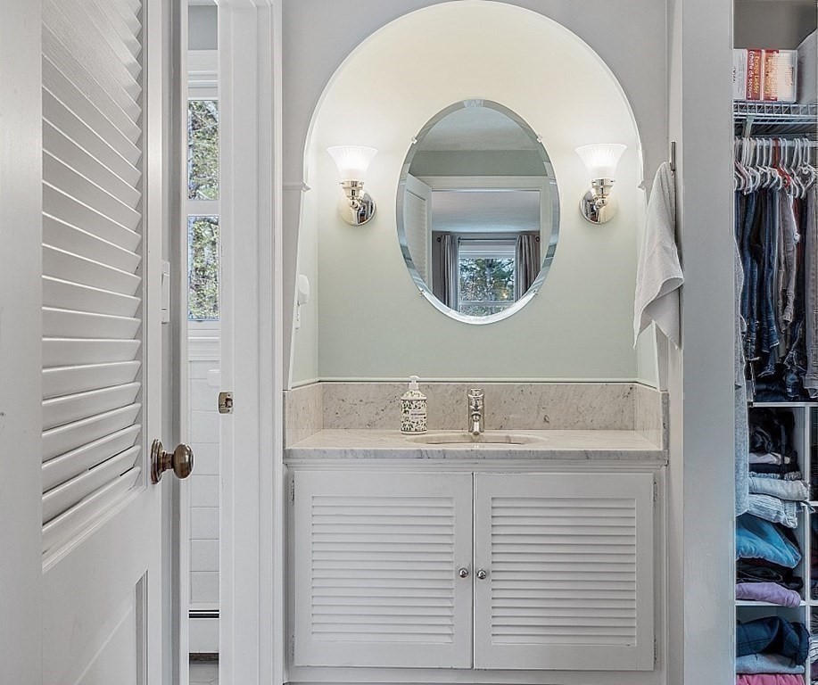 13 Olde Farms Road Boxford, MA 01921 - Photo 31 of 42 a bathroom with a sink a mirror and a shower curtain