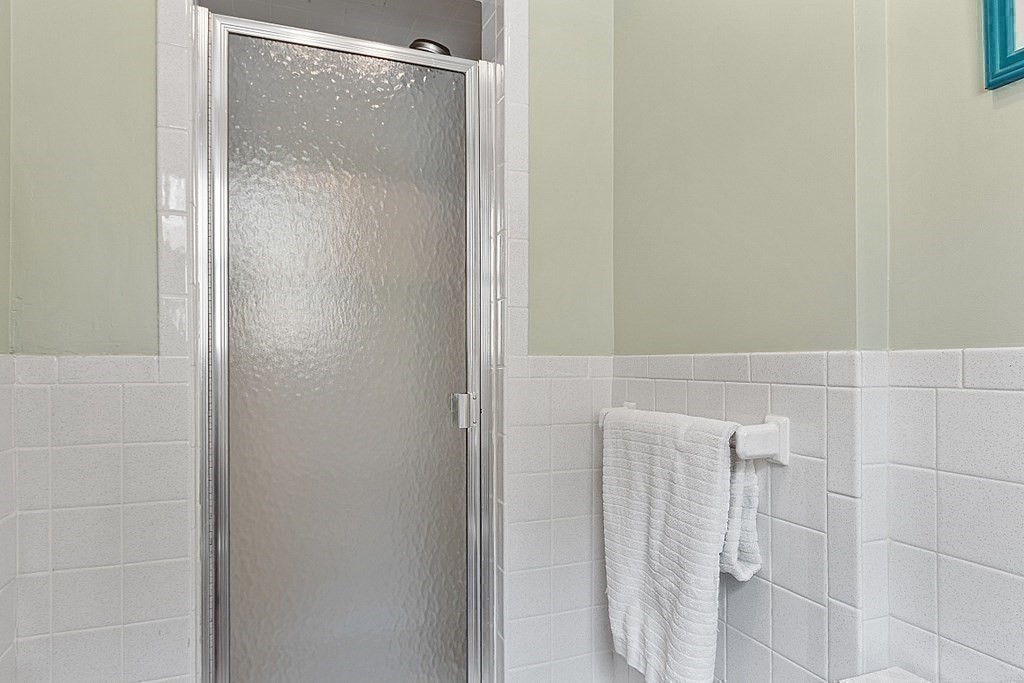 13 Olde Farms Road Boxford, MA 01921 - Photo 32 of 42 a bathroom with a glass shower door