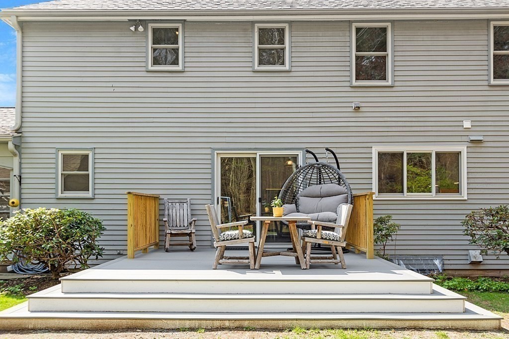 13 Olde Farms Road Boxford, MA 01921 - Photo 4 of 42 a view of a house with wooden bench and chairs