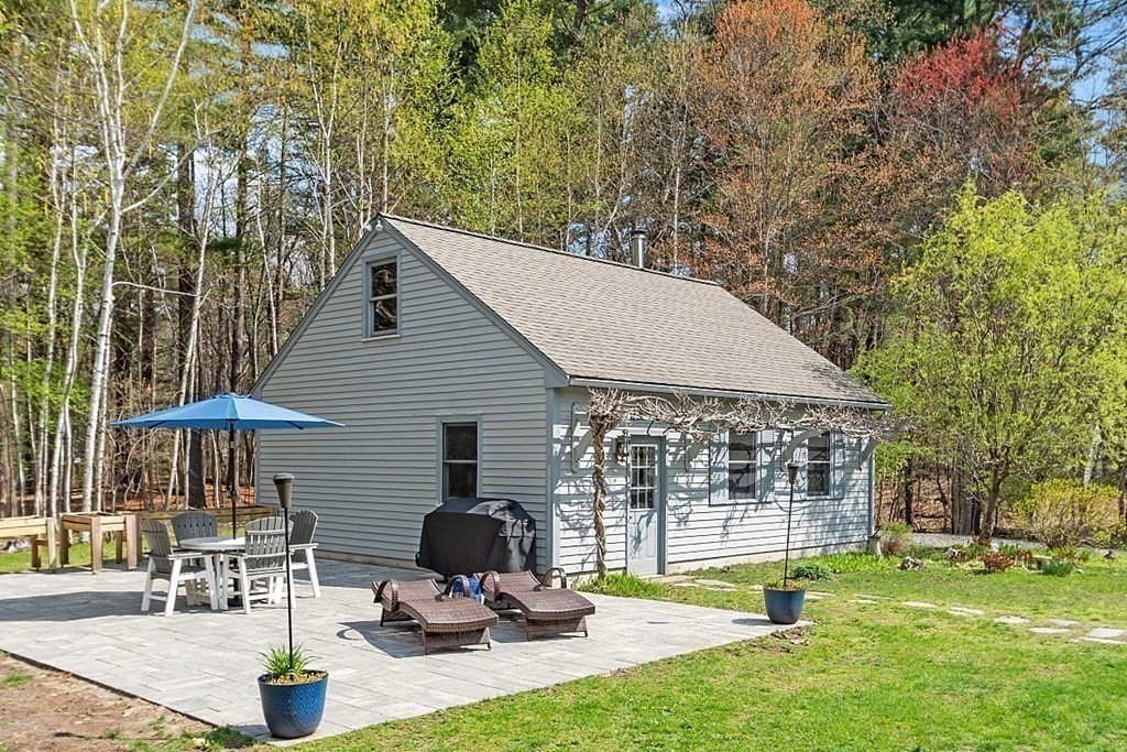 13 Olde Farms Road Boxford, MA 01921 - Photo 6 of 42 a view of a house with backyard and sitting area
