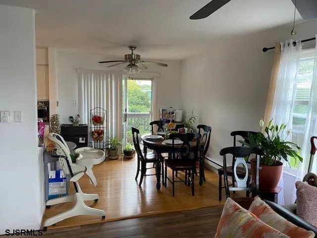 a view of a workspace with furniture and a potted plant