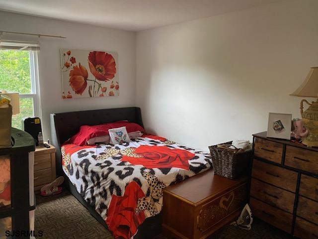 772 Jane Drive Manahawkin, NJ 08050 - Photo 18 of 18 a bedroom with a bed and dresser