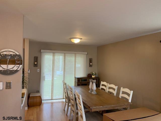 772 Jane Drive Manahawkin, NJ 08050 - Photo 6 of 18 a view of a dining room with furniture and wooden floor