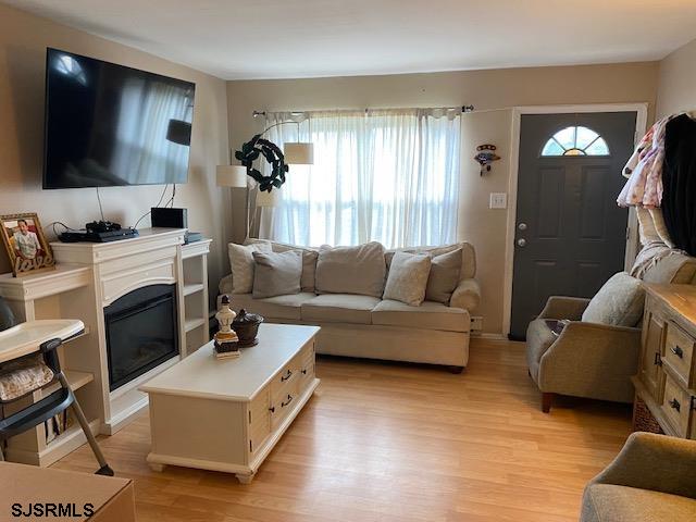 772 Jane Drive Manahawkin, NJ 08050 - Photo 7 of 18 a living room with furniture and a flat screen tv