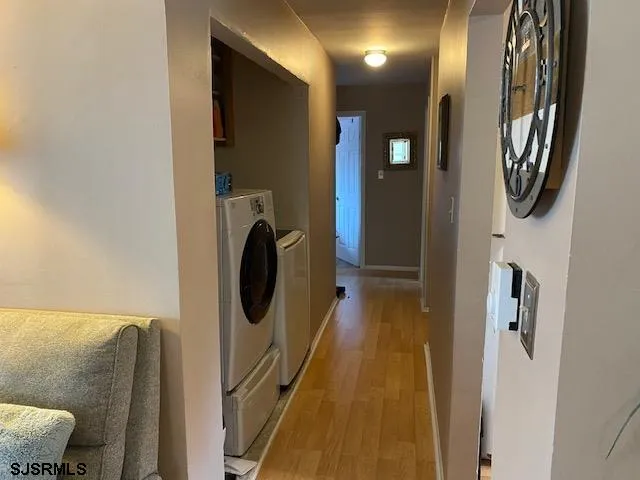 a bathroom with a mirror and a bathtub