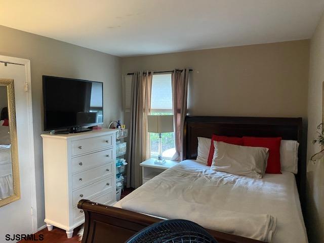 772 Jane Drive Manahawkin, NJ 08050 - Photo 10 of 18 a bedroom with a bed and a flat screen tv