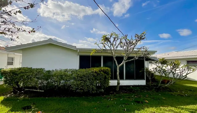 a view of a house with a garden
