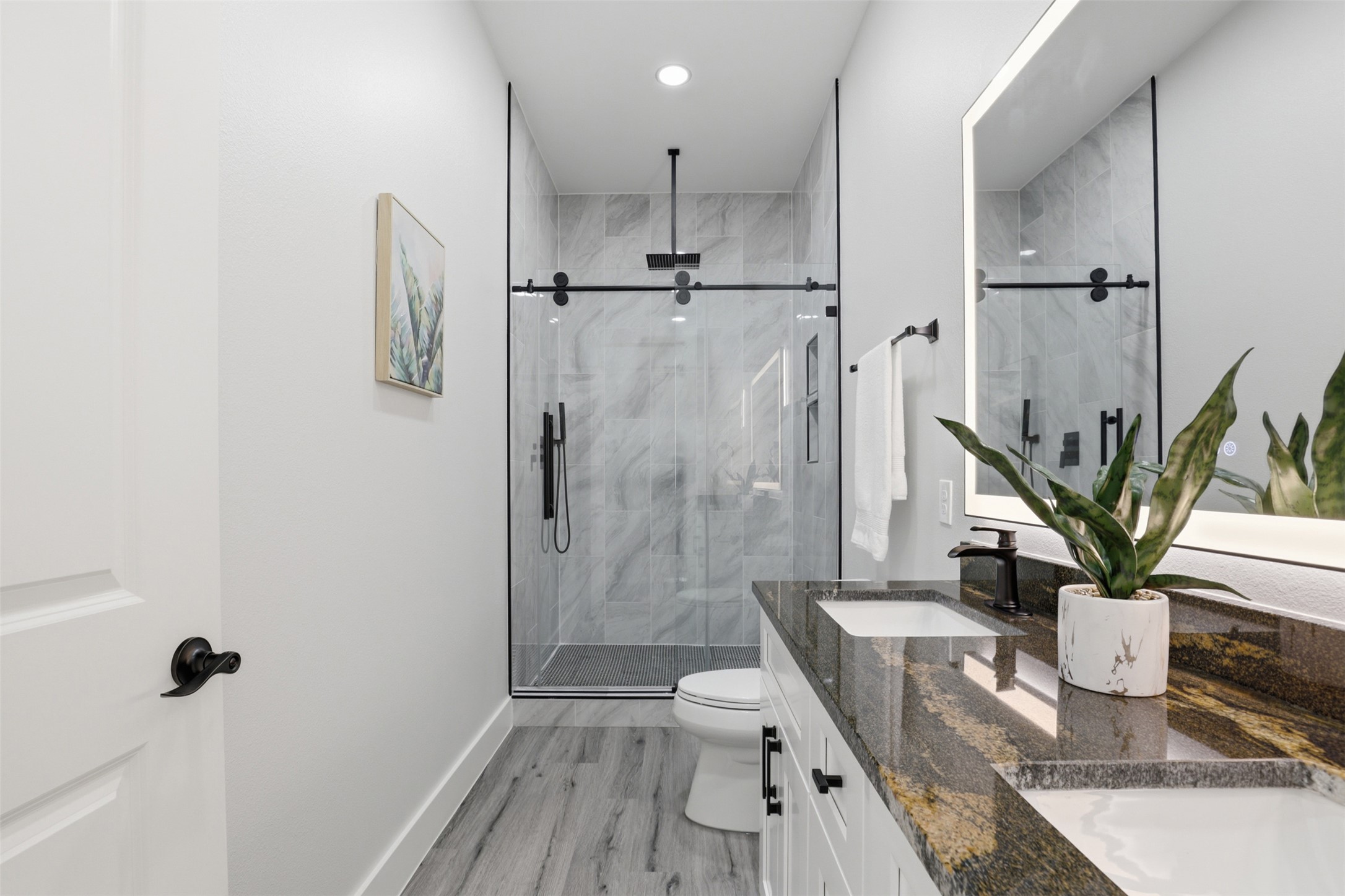 123 Los Robles Road Elgin, TX 78621 - Photo 18 of 21 Contemporary bathroom featuring a dual vanity with a polished granite countertop and undermount sinks