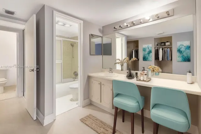 a view of bathroom with dual sinks