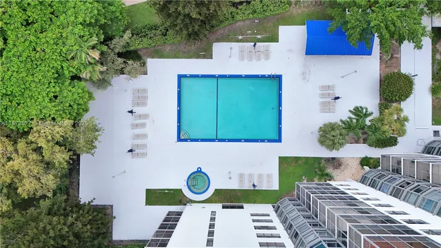a aerial view of a house with garden space and sitting area