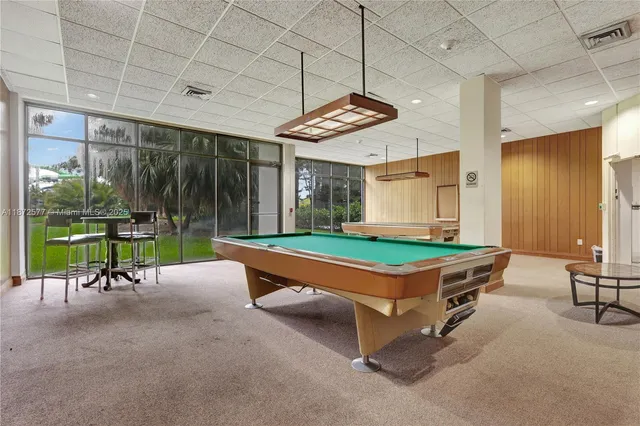 a park with large pool and outdoor seating