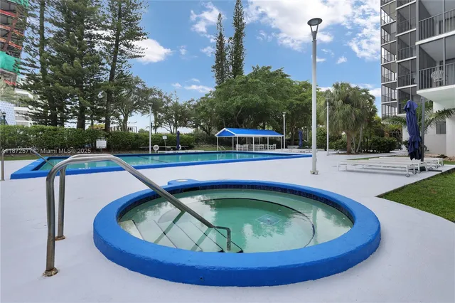 a view of a swimming pool with a patio