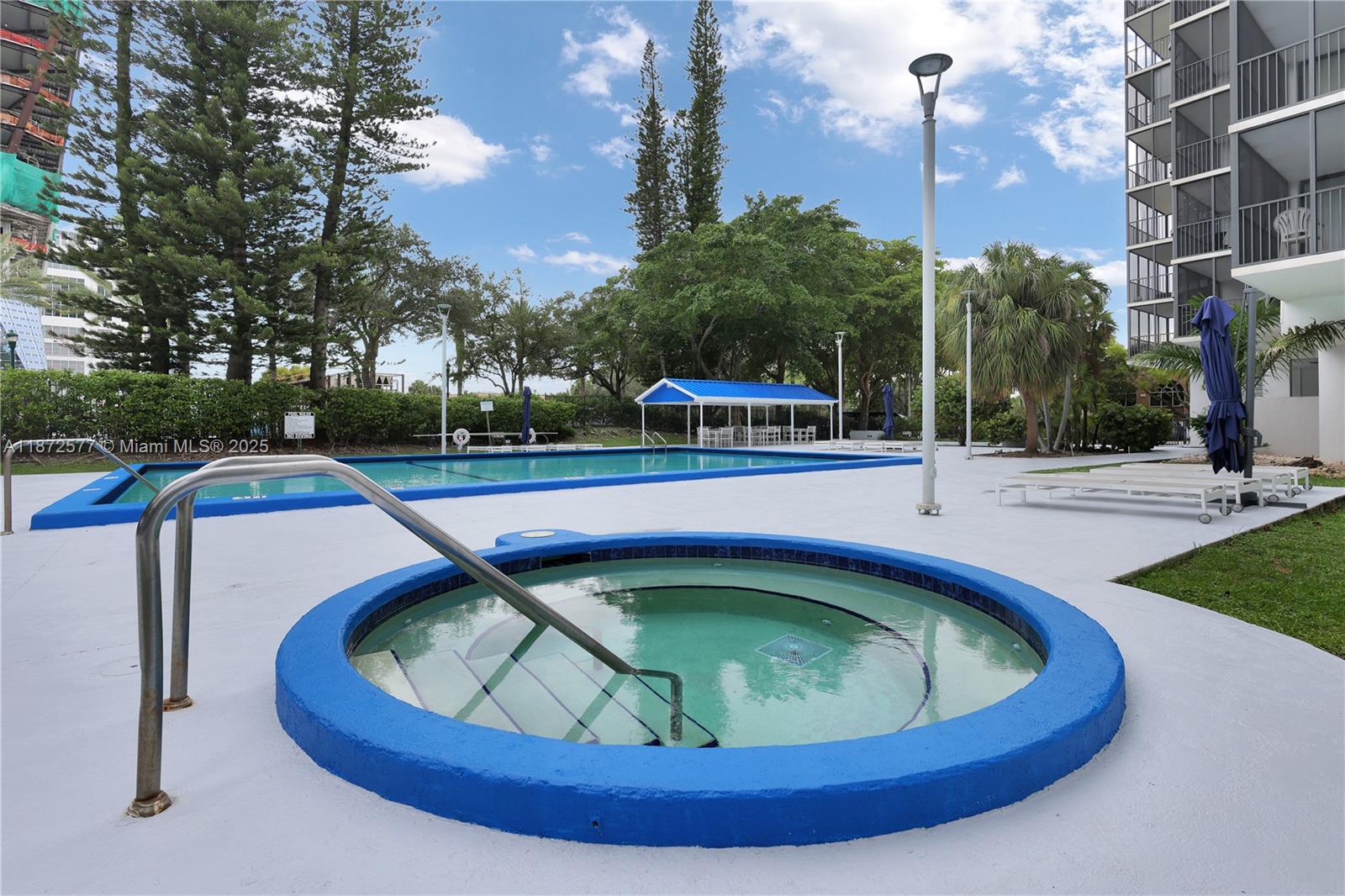 20100 West Country Club Drive, Unit 403 Aventura, FL 33180 - Photo 7 of 24 a view of a swimming pool with a patio