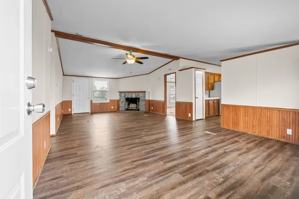 a view of a living room with wooden floor