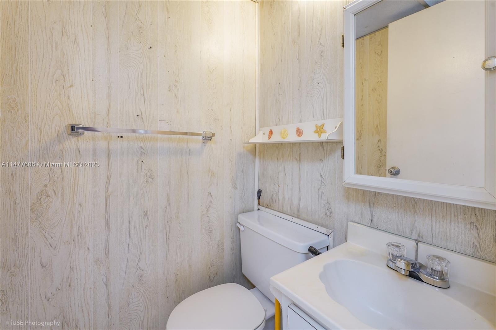 1037 Southwest 10th Avenue Miami, FL 33130 - Photo 12 of 19 a bathroom with a sink a toilet and a mirror