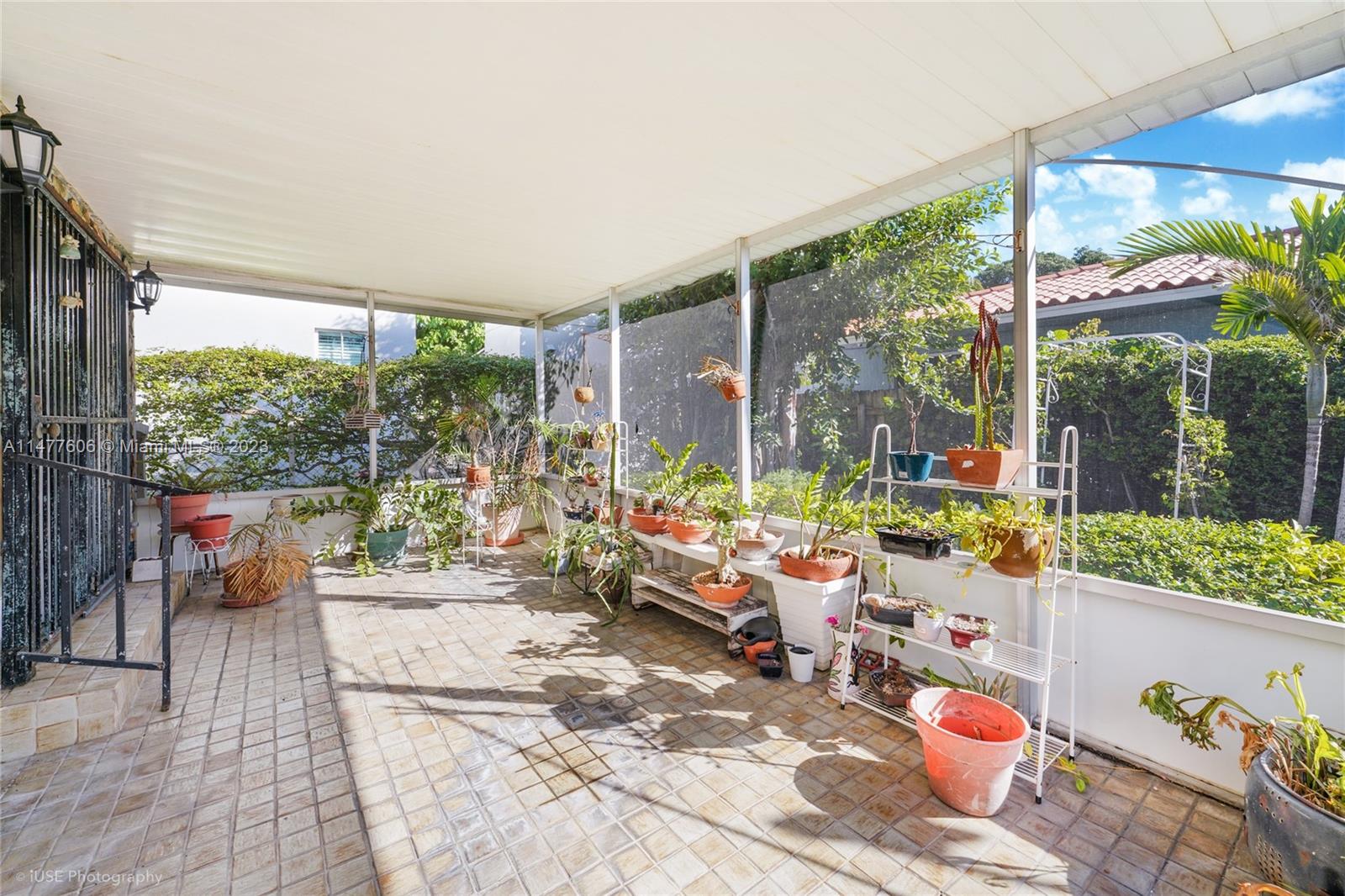 1037 Southwest 10th Avenue Miami, FL 33130 - Photo 13 of 19 a living room filled with furniture and a large window