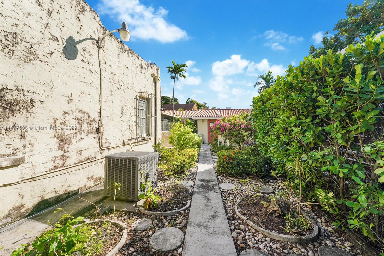 1037 Southwest 10th Avenue Miami, FL 33130 - Photo 16 of 19 a garden with a fountain in front of the house