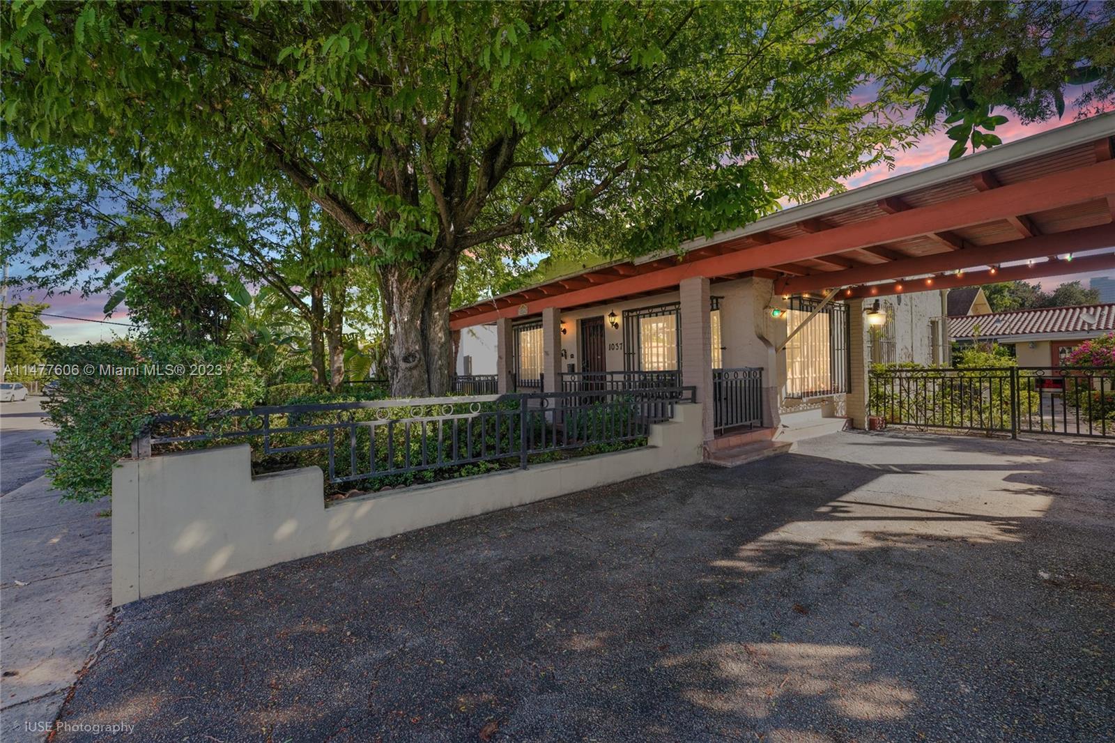 1037 Southwest 10th Avenue Miami, FL 33130 - Photo 19 of 19 a view of a house with a yard and potted plants