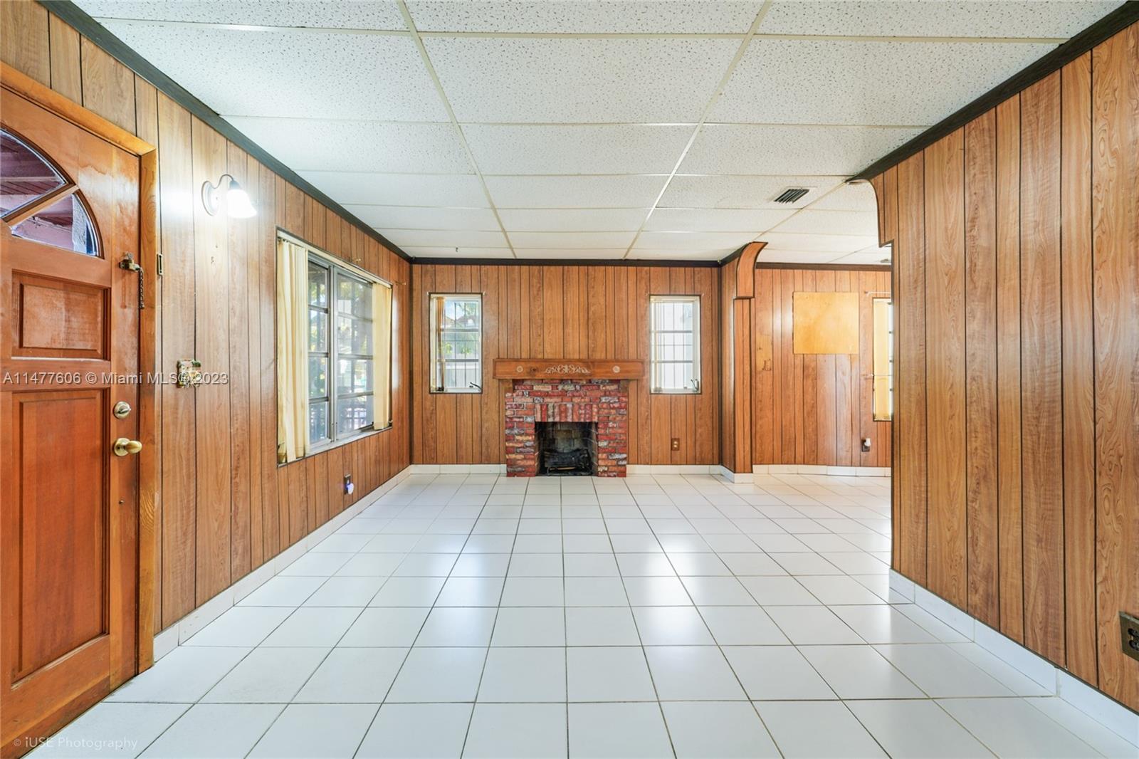 1037 Southwest 10th Avenue Miami, FL 33130 - Photo 6 of 19 a view of an empty room with a window