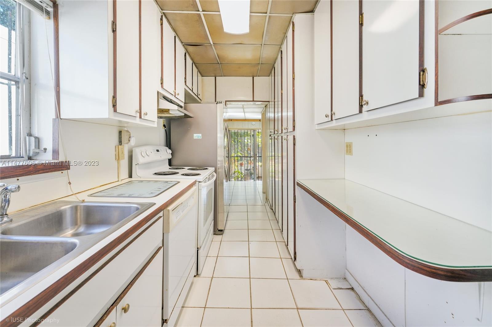 1037 Southwest 10th Avenue Miami, FL 33130 - Photo 7 of 19 a kitchen with a sink and cabinets
