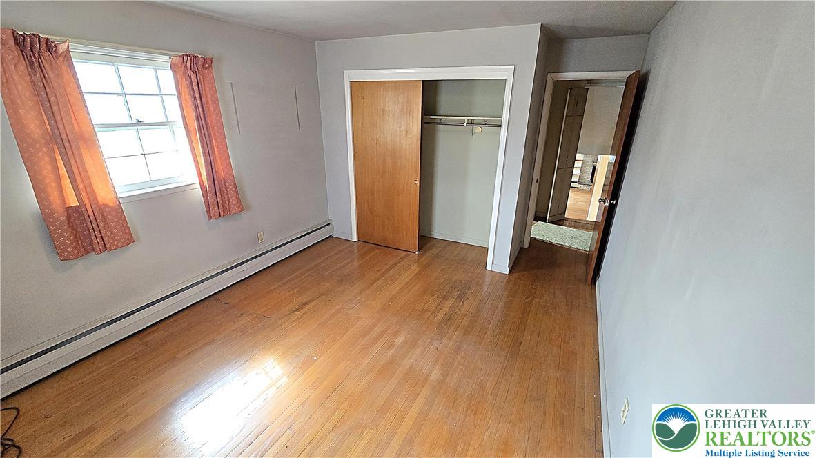 232 Virginia Avenue Whitehall, PA 18052 - Photo 15 of 26 a view of an empty room and wooden floor