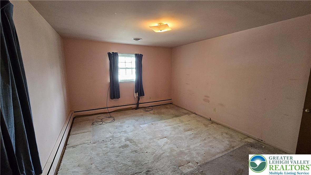 232 Virginia Avenue Whitehall, PA 18052 - Photo 18 of 26 an empty room with windows and closet